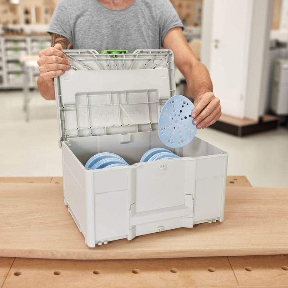 Man holding Granat abrasives in open Systainer