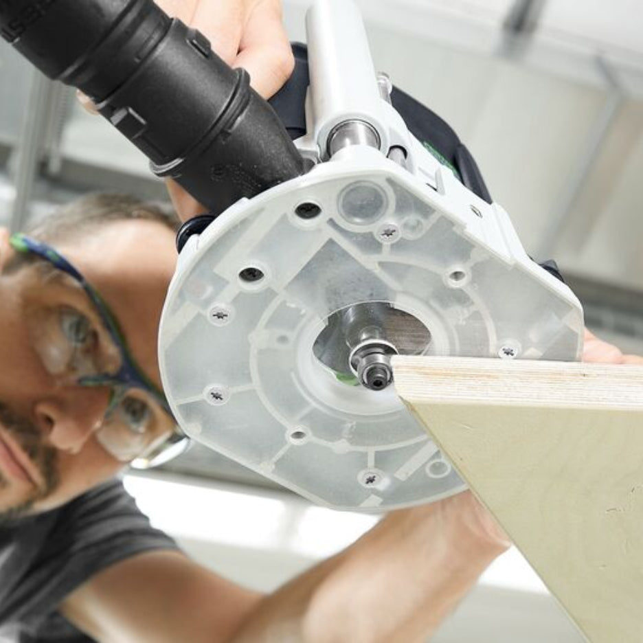 Man using OF 1010 with Festool Base LAS-OF 1010 R attached to it