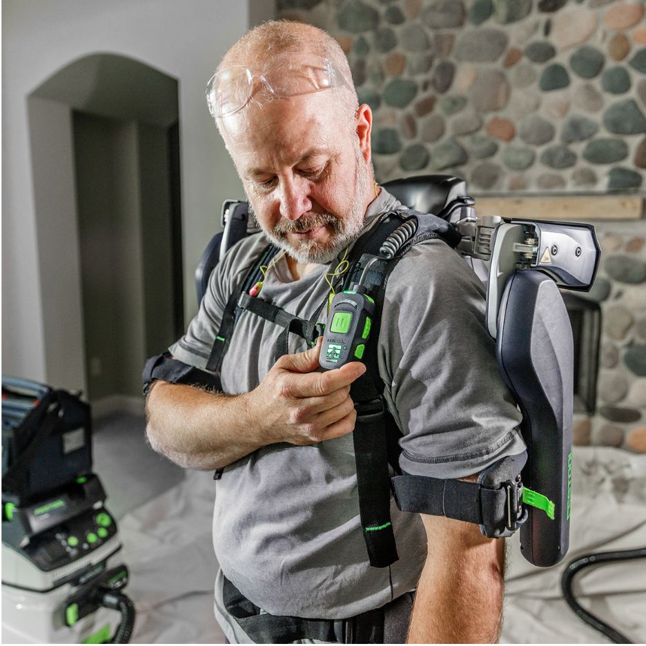 Man wearing Festool Exoskeleton ExoActive EXO 18 HPC 4.0 I-Plus and adjusting its support