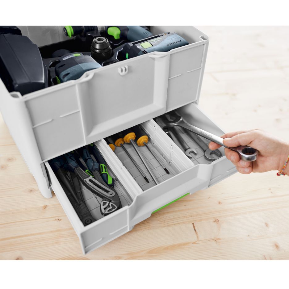 Hand holding wrench in bottom drawer of Festool Systainer SYS3-COMBI M 337