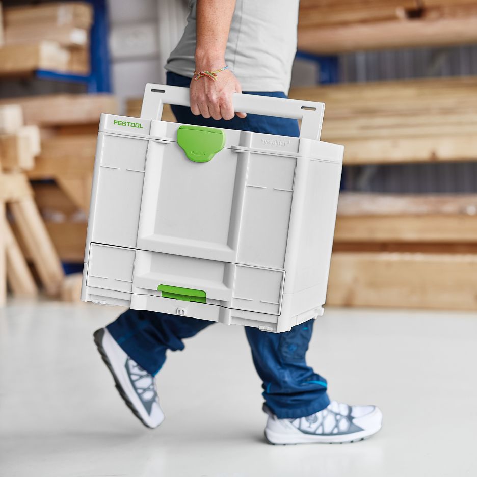 Person carrying Festool Systainer SYS3-COMBI M 337 by its handle