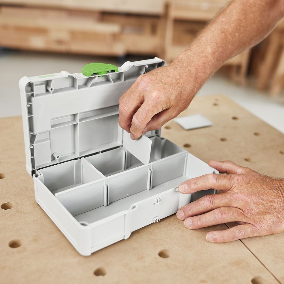 Hands inserting short partition into Festool Systainer SYS3 S 76